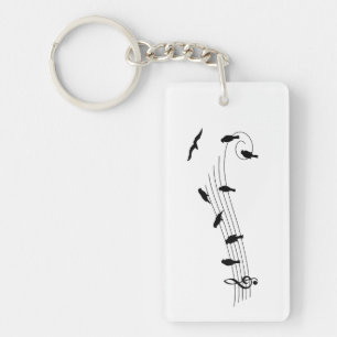 Muziekbalk met vogels als muzieknoten. sleutelhanger