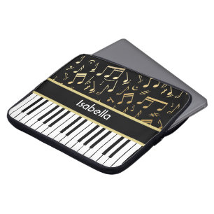 Muzieknoten en pianoketoetsen, zwart en goud laptop sleeve