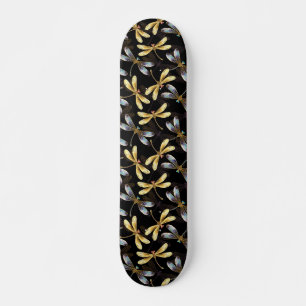 Naadloos patroon met gouden libellen skateboard