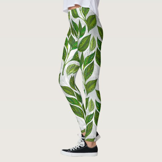 Naadloos patroon met groene theebladeren leggings (Links)