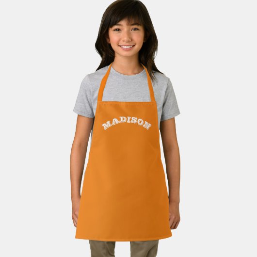 Naam aanpassen, tekst wit gebogen letters sinaasap schort (Insitu)