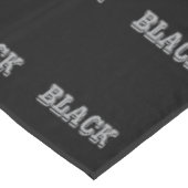 Nappe Noir Avec Texte Gris Sur Couleur Solide Noir (Angle)