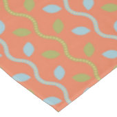 Nappe Vins bleus et verts rétro sur motif floral orange (Angle)