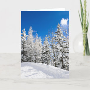 Neige sous une carte de voeux bleu clair