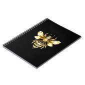 Nep goud folie logo bij polygonaal op zwart notitieboek (Linkerzijde)