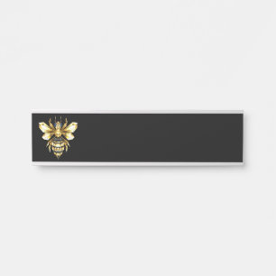 Nep goud folie logo bij polygonaal zwart deurbordje