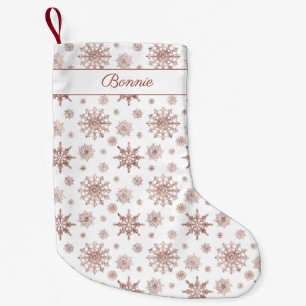 Nep roze gouden kleur lijkende sneeuwvlokken & naa kleine kerstsok