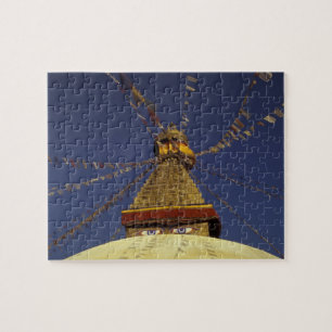 Nepal, Kathmandu. Onder gebedsvaandels, waakzaam Legpuzzel