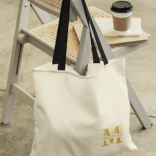 Neutraal beige goud monogram draagtas