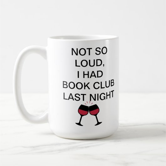 Niet zo luid, ik had gisteravond een boekenclub. koffiemok (Links)