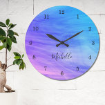 Nom Monogram Pink Purple Blue Large Clock<br><div class="desc">This colourful Wall Clock is decorated with a swirl pattern in rose,  blue and purple. Easily customizable with your name or monogram Use the Customize Further option to change the text size,  style or color if you wish.</div>