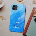 Nom Monogramme bleu<br><div class="desc">Cette élégante coque iphone est décorée dans des tons bleus avec un design de lave-linge aquarelle. Facilement personnalisable avec votre nom, et monogramme. Utilisez l'option Personnaliser supplémentaire pour modifier la taille, le style ou la couleur du texte si vous le souhaitez.</div>