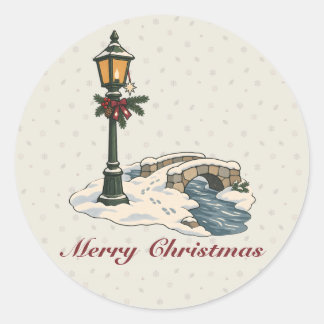 Noordelijke kerstlantaren bij een besneeuwde stene ronde sticker