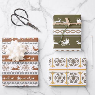 Noordse groene, rode en grijze sneeuwvlokken en he inpakpapier vel