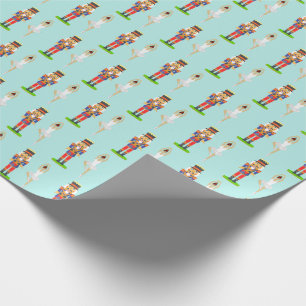 Notenkraker en balletdanseres op licht teal cadeaupapier