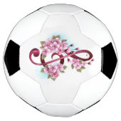 Notes de clef musicale en treble avec des fleurs S (Tourné)