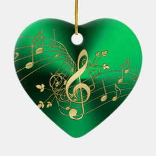 Notes de musique et ornement verts de Noël de clef