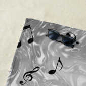 notes de musique noires dans serviette de plage ar (En situation)