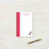 Notes de post-it roses de remous rouges et roses (Sur un bureau)