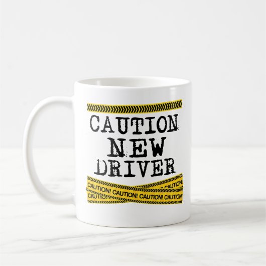 Nouvelle tasse de café de conducteur de précaution (Gauche)