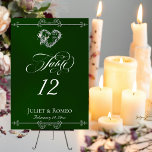 Numéro De Table Calligraphy & Silver Heart - Emerald Table Number<br><div class="desc">The design features an elegant emerald green background embellished with scroll borders, a heart and placeholders for the table number, couple's names and date of event. Available in several colors for your wedding theme. Designed to coordinate with the Romantic Scroll Hearts & Calligraphy Wedding Collection. To change details, click «Personalize»....</div>