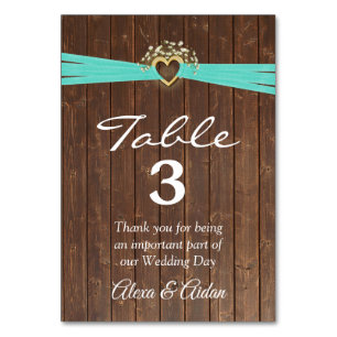 Numéro De Table Coeur d'or avec ruban turquoise sur le bois de la