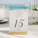 Numéro De Table Coeurs dans le sable destination mariage plage<br><div class="desc">Il comprend deux coeurs dans le sable et les initiales de la mariée et du marié avec eau turquoise et arrière - plan de plage de sable blanc,  de grandes cartes de table pour le mariage de plage d'été,  ou mariage de destination tropicale.</div>