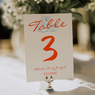 Numéro de table de mariage orange coloré dessiné à
