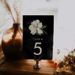 Numéro De Table Élégant Magnolia Mariage noir et blanc<br><div class="desc">Faites une déclaration sophistiquée lors de votre journée spéciale avec nos élégants panneaux de numéro de table mariage magnolia. Ces panneaux apportent une touche glamour à votre décoration mariage. Doté d'une magnolia blanche sur un arrière - plan d'aquarelle noire, les numéros de table apporteront un air de sophistication et de...</div>