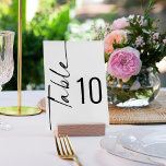 Numéro De Table Élégante calligraphie pivotante Mariage noir blanc<br><div class="desc">Élégante calligraphie pivotée Mariage noir blanc. Table est définie dans un script pivoté stylisé vers la gauche et votre numéro de table vers la droite. Personnalisez facilement le numéro et ajoutez chaque numéro à votre panier séparément au fur et à mesure que vous le modifiez. La même conception est de...</div>