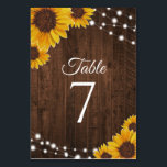 Numéro De Table Fleurs de soleil sur bois et lumières à cordes Mar<br><div class="desc">Ce modèle de carte de numéro de table mariage rustique présente de jolis tournesols aquarelés et des lampes à cordes sur un arrière - plan en bois foncé. Cliquez sur le bouton personnaliser pour plus de flexibilité dans la modification du texte ! Des variantes de cette conception ainsi que des...</div>