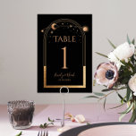 Numéro De Table Mariage d'astronomie mystique Black Gold Sun Moon<br><div class="desc">Mystical Black Gold Sun Moon Astronomy Mariage Table Numbers présente soleil doré, lune et étoiles avec cadre doré sur un arrière - plan noir. À l'intérieur, vous trouverez vos informations d'invitation de mariage personnalisées. Personnalisez en modifiant le texte dans les zones de texte. Conçu pour vous par Evco Studio www.zazzle.com/store/evcostudio...</div>