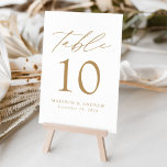 Numéro De Table Mariage d'élégance moderne blanc et or<br><div class="desc">Trendy, minimalist wedding table number cards featuring gold modern lettering with "Table" dans calligraphy script moderne. The design feh white background or a color of your choice. Le design repeats on the back. To order the table cards: add your name, wedding date, and table number. Add each number to your...</div>