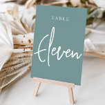 Numéro De Table Table ELEVÉE Turquoise à main Dusty<br><div class="desc">Des cartes numériques simples et chic en aqua turquoise poussiéreux et blanc font une déclaration élégante à votre mariage ou événement. Le design comporte "table [nombre]" dans un mélange de sérigraphie classique et de lettres manuscrites. Le design se répète de part et d'autre. Cartes numérotées individuellement vendues séparément; commandez chaque...</div>
