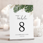 Numéro De Table Végétation tropicale Botanique Mariage Boho d'été<br><div class="desc">Dirigez vos invités avec une sophistication tropicale à l'aide de ce design personnalisé captivant de numéro de table. Des feuilles verts vifs et des contours dorés chatoyants couronnent élégamment un arrière - plan blanc immaculé, créant ainsi un point focal chic et naturel pour vos tables. Cet exquis art botanique ajoute...</div>