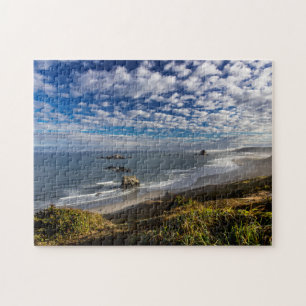 Ochtendwolken en mist op het strand legpuzzel