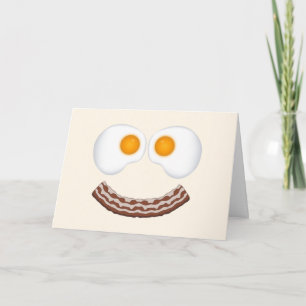 Oeufs et carte de voeux de grimace de lard avec la
