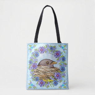 Oiseau dans le nid sur tout le sac fourre-tout