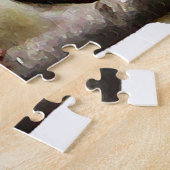 Oiseau jaune de chardonneret sur le puzzle bleu (Côté)