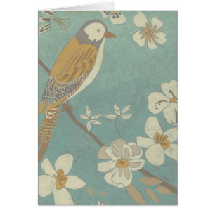 Oiseau jaune, gris et beige perché sur une branche