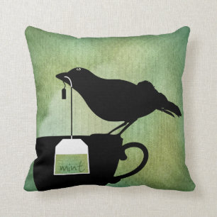 Oiseau sur un coussin de tasse de thé
