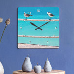 Oiseaux blancs de mouette sur corde bleu turquoise<br><div class="desc">Il y a de bonnes vibrations partout quand vous regardez l'heure sur cette horloge murale colorée et photographique. Des mouettes joyeuses, blanches et grises se détendent sur une barrière en corde dressée contre l'océan turquoise et vibrant. Fait un grand cadeau de ménage! Vous pouvez facilement personnaliser cette horloge murale. S'il...</div>