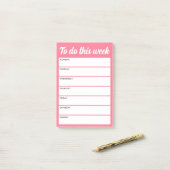 Om deze week roze weekplanner te doen post-it® notes (Op bureau)