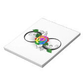 Oneindigheidssymbool met regenboogroos notitieblok (Gedraaid)