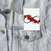 Oneindigheidssymbool met rode rozen button (Insitu)