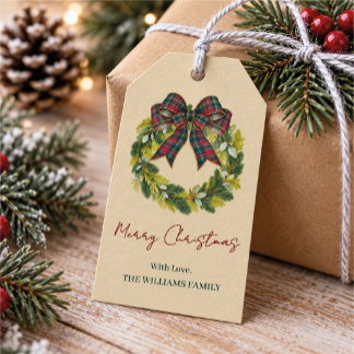 Op maat gemaakte kerstkrans met tartan lint en fam cadeaulabel