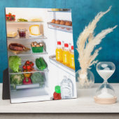 Open koelkast gevuld met voedsel fotoplaat (Zijkant)