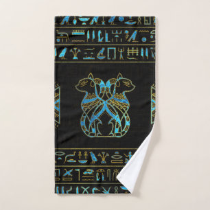 Or de chats égyptiens et verre souillé de bleu