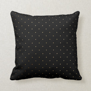 Or et coussin noir de point de polka