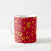 Or et tasse orange de monogramme de léopard (Devant gauche)